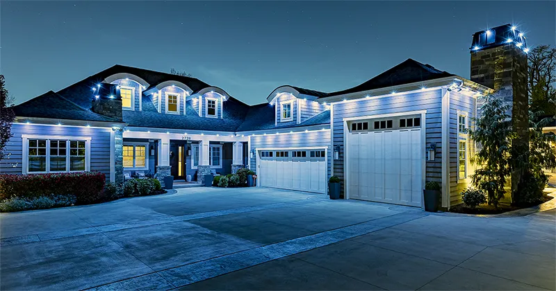 House lit up in blue and white