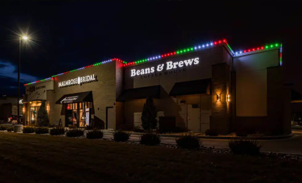 Three storefronts with building curb appeal using a permanent exterior lighting system