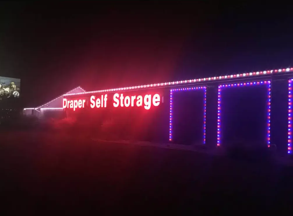 Building accent lighting on the outside of a business storefront named Draper Self Storage